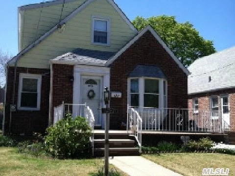 Lovely 4 Bedroom Cape With A Detached 2 Car Garage. Full Partially Finished Basement With Dry Bar. Original 1st Floor Hardwood Floors. New Roof. No Neighbors Across The Street. Convenient To All (Shopping, Houses Of Worship, City Buses, Major Highways, Etc.).