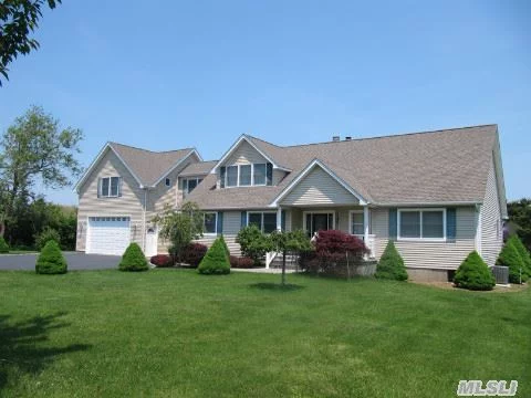 Lovingly Kept Contemporary In A Beach Community With Soothing Water Views From The Second Story Deck. Four Bedrooms, Three Baths, Office, With Porch, First And Second Floor Decks. Well Maintained, Protected Garden With Sprinkler System. Just Minutes From The Beach In Tranquil Orient.