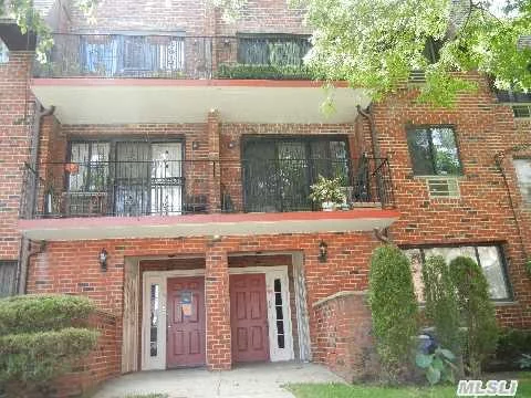 Lovely 2nd Fl Duplex Condo Featuring 3Bedrooms, 2 Baths, Balcony & 1 Car Garage. Hardwood Floors, New Stainless Steel Stove & Fridge, Storage Room, & W/D.