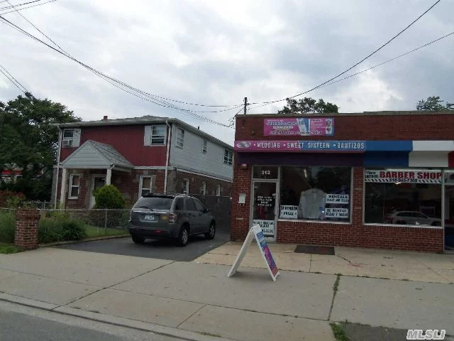 Legal 2 Family (2 2Br. Apts)& 2 Retail Storefront Stores. 2 Car Det. Garage, Huge Back Yard. Large Property W/3 Bldgs. Main Street. Four Separate Rental Spaces All Rented. Great Opportunity For Landscape/Construction Business, Retail Business, Etc.