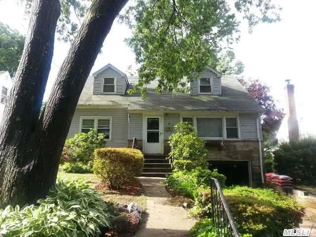 Large Dormered Cape With Beautiful Wood Floors And Freshly Painted. Flat Private Yard In South Huntington School District. Possible M/D With Proper Permits.