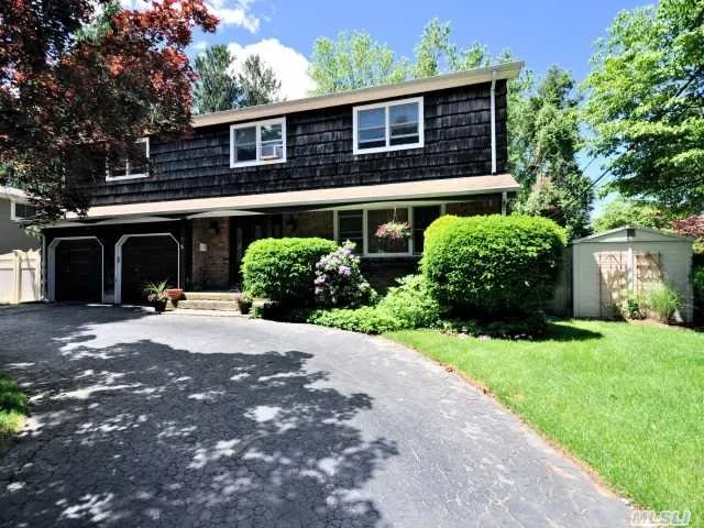 Spacious 4 Br 2.5 Ba Colonial Walk To Town And Lirr. Updated Kitchen With Wood Cabinetes And Granite Counter And S/S Appliances. Crown Molding And Wood Floors Thru-Out. New Window And Gas Heating Systems, Fam Rm W Fpl And Sliders To New Trex Deck. Fenced In Yard.