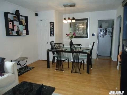 Beautiful Suite, Tastefully Upgraded, New Carpet, Ample Rooms, Hardwood Floors. Features: Lr/Dr/Ei.Kitchen/2 Bedrooms/1 Full Bathrm/Attic W/Pull Down Ladder. Sd#26, Cardozo Hs, Easy Access To Transp. Buses Q27/Q75/Q88/Qm1A. And Convinient To All.