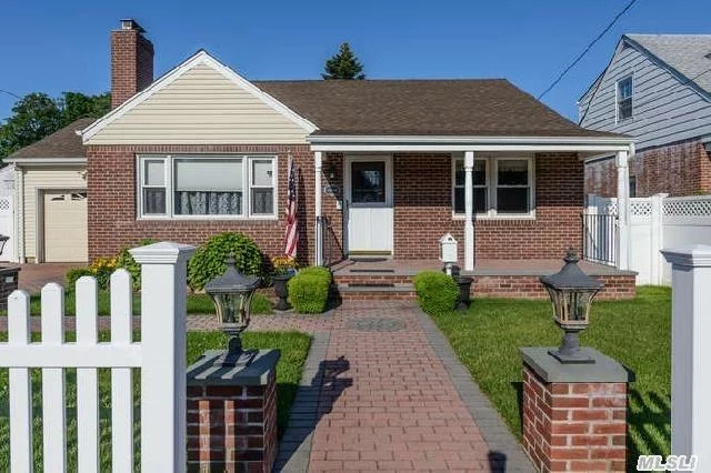 Mint Condition Totally Renovated & Re-Built Brick Ranch Set On Level Deep Fenced Property With Decorative Brick Patios, Covered Porch & Shed.  Fabulous! Beach & Golf Rights!