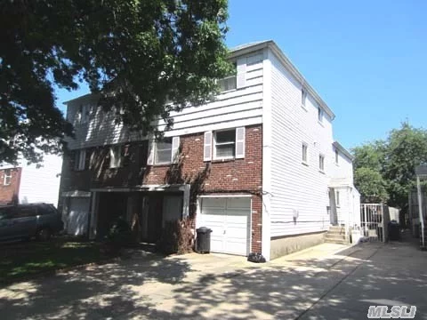 Semi-Detached Triplex/Duplex 2 Family In The Heart Of Bayside/Oakland Gardens Area.  Triplex Has 8 Foot Extension In Back Of House. Hardwood Floors Throughout.