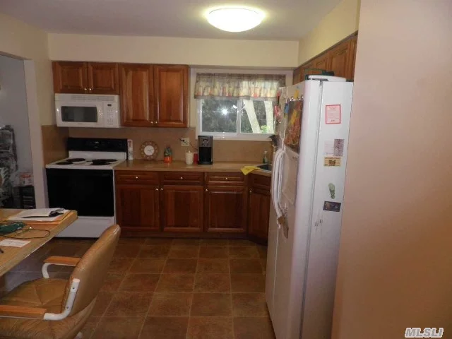 Renovated Kitchen And Bathroom, Spacious Living Room, Airconditioning, Dining Room, Real Nice Size Bedrooms, Washer/Dryer, Use Of Yard, Florida Room, Garage,  Close To Lirr, Shopping, Pkwys Utilities Extra Oil Heat And Electric..This Place Is Real Nice, Super Clean, Modern And Updated