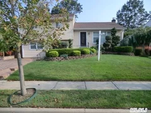 Beautiful Modern Split Level Located Mid-Block On A Tree Lined Street. This Home Boasts New Kitchen, New Hardwood Floors, New Roof And Siding. Updated Windows, Large Oversized Den W/Fireplace, Sliding Glass Doors To Gorgeous Deck And Patio W/Large Yard. This Is Truly A Beautiful House-Come Make It Yours!