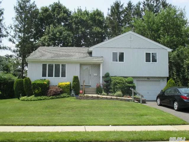 Gorgeous Extended Split, 4 Br, 3 Fbaths, Updates Incl Kitchen, Baths, Anderson Windows, Furnace, Roof, Siding, New Driveway, New Chimney Liner, Hi Hats, Gas Cooking Room For Extended Family, Master Br With Fbath, Beautifully Landscaped. Must See!