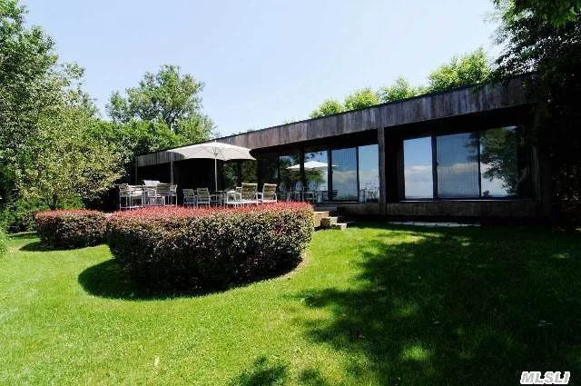 Distinctive Mid-Century Modern Home On The Sound. Iconic Glass And Redwood, Designed For Their Personal Use By Renowned Architects Abercrombie And Vieyra. Meticulously Restored And Landscaped By Present Owner! Open Plan, 4 Bedrooms, 2 Baths.Steps To Pvt. Beach. Enjoy Panoramic Views Of Li Sound, Along With Nature&rsquo;s Backdrop Of Magnificent Sunsets! New To The Market!
