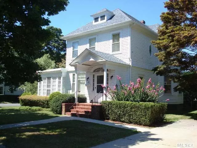Situated On A 1/4 Acre In Greenport Village, This Charming 1920S Home Has Many Original Period Details Including Stain Glass Windows, Crown Moldings, & High Ceilings. First Floor Has A Feeling Of Separate Spaces Yet Has An Easy Flow Leading Out To The Enclosed Side Porch. Front & Back Staircases Lead To 2nd Floor With 3 Or 4 Bedrooms And Full Bath. Zoned For 1 Or 2 Family.