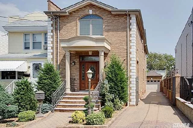Beautiful 1 Family Custom Built Home Located In The Heart Of Middle Village, Prvt Driveway, Huge Kitchen , Granite Tops And Sub Zero Appliance, Private Yard, Full Finished Basement..A Must See.