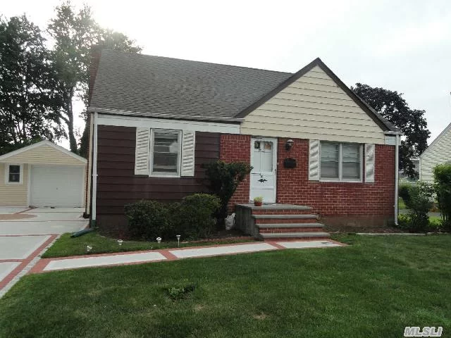 Great Potential In This Midblock Cape In The Heart Of Hicksville.Great Large Property 62X125.New Driveway, Walkway, Front Steps.Newer Bathroom, Roof, Heating System.Convenient To Shopping(107), Lirr, Pkwys.House Faces East.Taxes Do Not Include Additional Star Savings Of $919.34