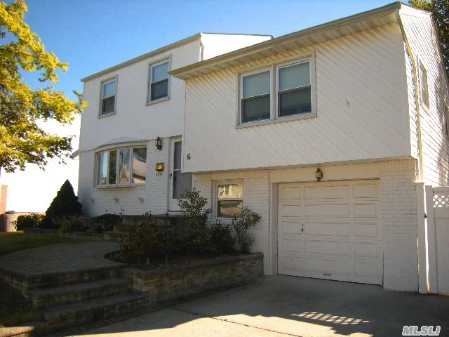 Spacious 4Br Split Level Home With 2 Full Baths, Gas Cooking, Updated White Kitchen Cabinets, Dining Room With Sliding Door To Yard. Hardwood Floors Throughout, Great Interior Location, Situated On Over Sized Lot, Updated Windows, Siding, Paver Walk & Driveway, Main Floor Laundry/Mudroom, Great Opportunity To Make It Your Own.