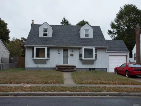 Spacious Cape Cod In Midblock Location. Property Lovers Delight! Best Value In Plainedge Schools #18. A Must See! Taxes Do Not Reflect Star Savings!