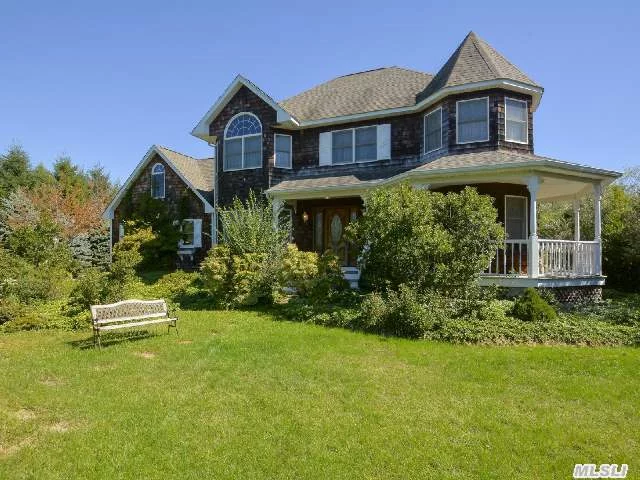 Cedar Shake Victorian Located Two Doors Down From Deeded Bay Beach. House Is On Shy Acre W/ Gunite Waterfall Pool. Open Floor Plan With Enclosed Sunroom, 3Bedrooms & 3Baths. Located In Sought After Angel Shores Community. Sit On Front Porch And Listen To Waves Crash On Beach.