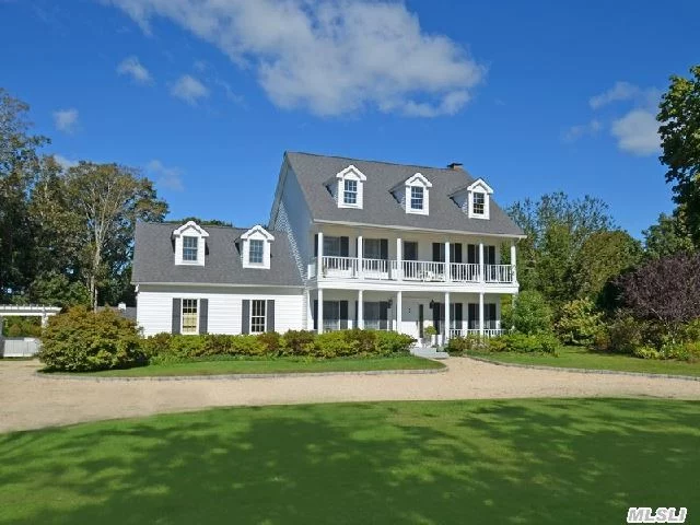 Beautifully Landscaped Georgian Colonial With Double Front Porches Situated On 1 Acre With Extensive Gardens, Fountain, Specimen Trees And Flowering Plants, Room For A Pool! Beach Rights And Easy Access To Peconic Bay.