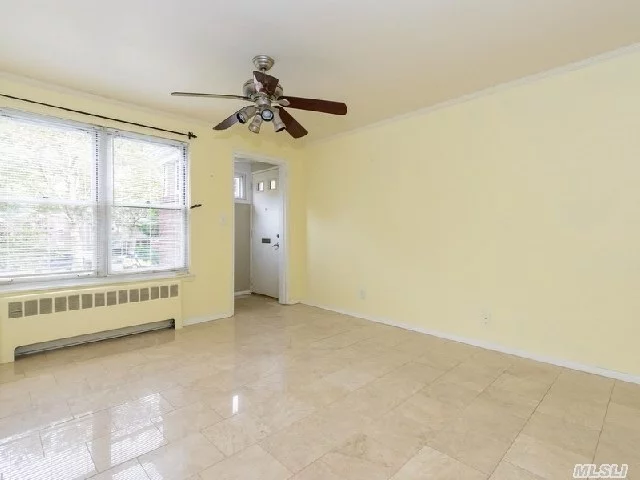 Secluded, Quiet Bayview Section. Courtyard Setting With Separate Entrance. Marble Floors In Lovely L-Shaped Living Room/Dining Room. New Kitchen, Near To Lirr, Major Highways, Schools And Shopping.