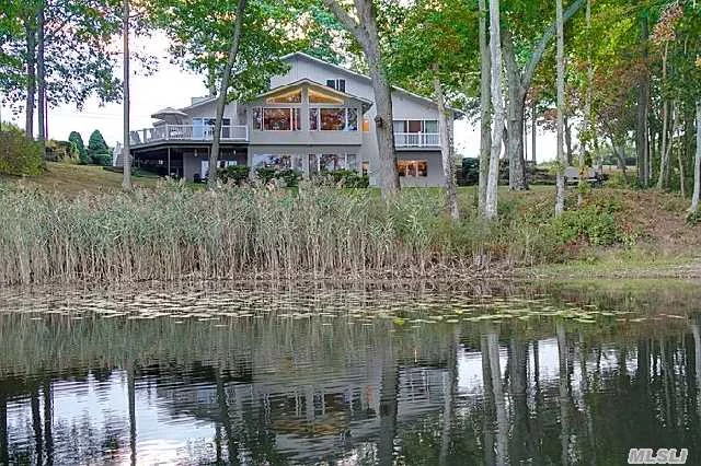 Beautiful Lakefront Retreat On The Coveted Western Shore Of Laurel Lake - Down A Magical Private Lane, Surrounded By Preserved Woodlands & Fields, This 5 Br Contemporary Enjoys Spectacular Views Of Pristine Laurel Lake From Its Very Private 2.4 Acre Setting Of Rolling Grounds. Enjoy Swimming, Kayaking, Paddle Boarding, Sailing, Fishing, And The Beauty Of Nature!