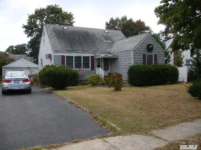 This Home Has Great Potential! 5 Bedrooms, Hardwood Floors Throughout, Private Yard With Large 2 Car Detached Garage, Full Basement, Easy Access To Southern State Parkway. Taxes With Basic Star $7366.57.