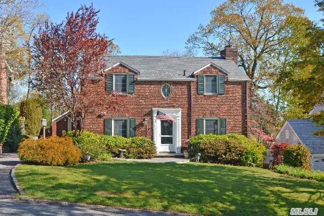 Beautifully Updated Brick Walter Uhl Colonial Overlooking Plandome Golf Course Abounds With Quality And Charm. Lovely Covered Porch And Expansive Brick Patio. New Kitchen, Baths, Anderson Windows.