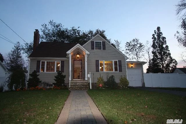 Babylon, Turn Key Updated Cape In Sought After Neighborhood South Of Montauk Hwy, This 3/2 Bedroom 1 /12 Bath Home Offers Beautiful Hardwood Flooring Throughout. Wood Burning Fireplace, New Windows, New Baths. Oversized 100 X100 Fenced Property On Quite Tree Lined Street