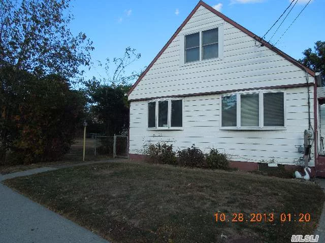 Cape With Updated Kitchen, Hardwood Floors, Great Potential.