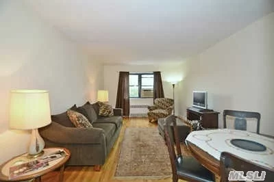 This Large Corner Line One Bedroom Unit Features Refinished Hardwood Floors, Plenty Of Windows, Four Closets, Renovated Eat In Galley Kitchen, New Refrigerator, Spacious Foyer And Double Exposures In The Bedroom. The Building Is Located In A Quiet Residential Environment Within Walking Distance To The E&F Subway Lines & Local Shopping. Connecting Highways Nearby.
