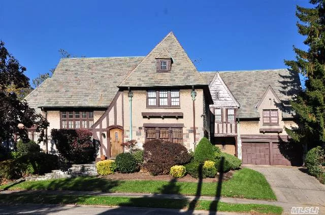 Large 5 Bedrooms 3.5 Bath Tudor Home In Jamaica Estates.This Home Offers A Gracious Living Room With Cathedral Ceiling, Gourmet Kitchen With Granite Counters, Large Center Island And Stainless Steel Appliances With Separate Breakfast Room, Office And Service Entrance With Access To The 2 Car Garage, Large Stone Fireplace, Hardwood Floors And More... A Must See! Won&rsquo;t Last!