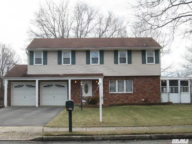 Desirable 4 Bedroom Colonial Splanch, Features A Wonderful Floor Plan, Den With Fireplace, Good Size Rooms, Siding And Updated Windows, 2 Car Garage, Sun Room & Large Property .46 Acre.Just Needs Updating, Taxes With Star $8979.40