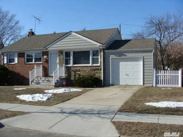 Nice Sized Property On Peaceful Street.Hardwood Floors Thru Out, Oak Kitchen Cabs, Wet Bar In Den, New Above Ground Oil Tank In Basement, New Pvc Fence Gates, And Refridgerator.Syosset Schools