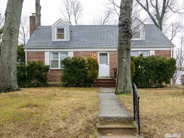 Spacious & Charming 4 Bedroom, 2 Full Bath Cape Cod Style Home In Mid Block Location With Large Property.  House Features Gas Heat/Cooking,  Interior Single French Doors With Large Rooms & Hardwood Floors Throughout.  Sold As-Is .  Close To Shopping & Schools. A Must See!