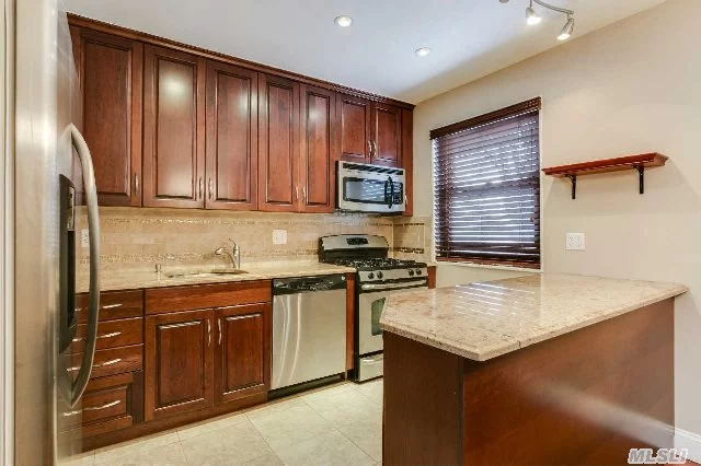 Beautiful 2 Bedroom Co-Op, Hardwood Floors Throughout Also Features A New Stainless Steel Kitchen With Granite Counters, New Bathroom And Two Bedrooms With The Master Bedroom Having Custom Built His And Her Closets. Co-Op Is Near Transportation.