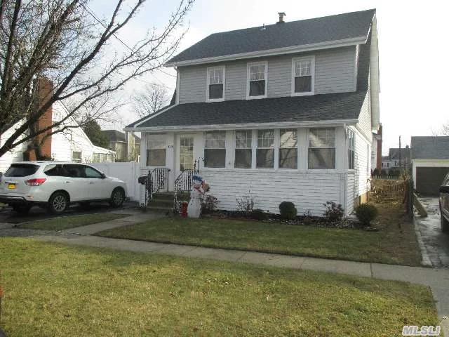 True Move-In Colonial W/ Lg Den Ext W/ Wood Burning Stove In Desirable Number Streets. Walking Distance To Schools, And Lirr. Brand New Gas Heat And Roof (1 Layer). New 1.5 Bths, Kit W/ New Ct Fl, Glass Tile Backsplash, Ss Appliances, Gas Stove. Newer Windows, Refinished Hw Fl, Brite Sunroom, Walk Up Attic Storage, 2 Car Gar. Taxes W/O Star @ 937. Best Buy In Hicksville!