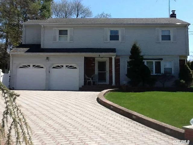 Beautifully Situated In North Syosset On A Private Cul-De-Sac--The One You Have Been Waiting For! Expanded And Spacious Colonial Featuring 4 Bedrooms And 2.5 Baths, Boasts An Updated Sun-Drenched Eat-In-Kitchen With Custom Cabinets, Granite Counters, Sub-Zero,  Leads To Sun Rm/Bar And Wine Frig & Den/Fpl,  With Views Of The Backyard And Pool.