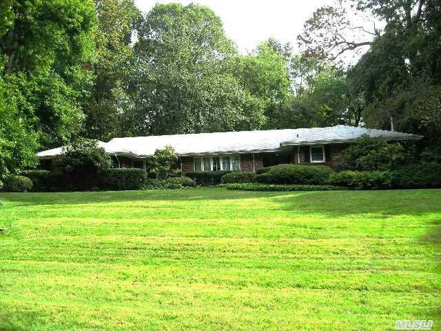 Bright And Spacious Custom Built Brick 5 Bedroom Ranch. Sunken Living Room With Bow Window, Formal Dining Room, Center Island Kitchen, Warm And Inviting Family Room With Brick Fireplace And Sliding Doors Onto Brick Patio. Private And Serene 2 Acres Of Perennial Gardens, Lush Landscaping, Serene Waterfall, Ig Pool, Cabana And Stone Pathways.