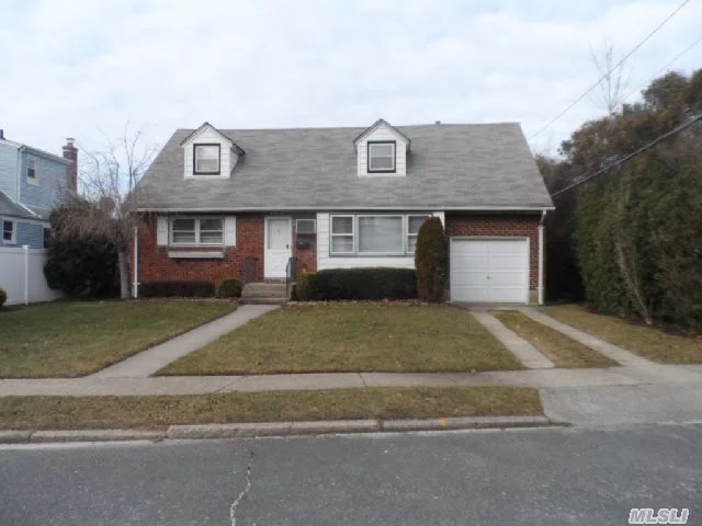 On Quiet Street. Ready To Move In.  The Interior Was Recently Renovated..New Kitchen (Granite Counter Tops, Stainless Steel Appliances, Ceramic Floors), Updated Bathroom, Redone Hardwood Floors, New Carpeting Upstairs, Large Bedrooms, Plenty Of Closet Space. New Boiler,  Oversized Garage, Full Clean Basement. Inground Sprinklers