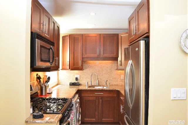 Spectacular 2 Br On 1st Floor, End Unit! Fully Renovated Only 4 Yrs Ago! Beautiful Hrdwd Flrs & Hi Hats In Lr, Granite And Stainless Steel Kitchen W/Washer & Dryer Combo In Unit! Custom Radiator Covers In All Rooms, Main. Heat Included. Quiet Block W/ Easy St Prking. Walking Dist To Bus, Lirr And Shopping. 1 A/C Plus 2 Ceiling Fans Inc. Meticulously Maintained!No Flip Tax!