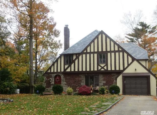 Majestic Tudor In Mint Condition. All Three Floors Completely Redone, New Kitchen And Designer Baths, Windows And Doors. Three Bedrooms Plus A Walk-Through, Stairs To A Large Walk Up Attic. Entire House Is Trimmed To Perfection. All Mechanics Are In Excellent Condition Including A Brand New Gas Generator By Generac. Walking Distance To Lirr, Town, Schools, Shopping.