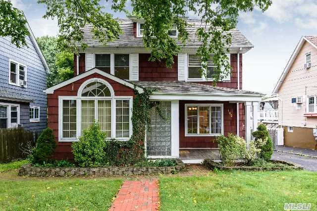 Charming Colonial In Convenient Location. Spacious Sunny Entry Opens To Living Room W/Gas Fireplace, Eik Overlooking Backyard, Casement Windows, Hardwood Floors, Attic W/4 Windows