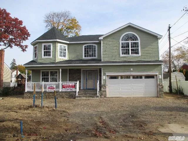 Prime Location In Syosset. 95% Finished-- Close By May! Large 4 Bdrm, 2.5 Bath Home W/ Bluestone & Pavered Porch, 2 Car Gar & Outside Bsmt Entrance! Gorgeous Trim & Details. Rare Oversized Prop. Close To Everything But In Quietest Of Neighborhoods. Main Pic Of Actual Home, Interior Pics For Workmanship. No Amenities Are Spared. Top Notch Energy-Efficient New Construction.