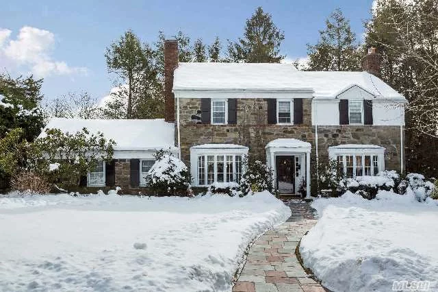 Stunning Fieldstone And Brick Center Hall Georgian Colonial Set In The Heart Of Munsey Park.  This Beautifully Renovated Traditional Home Features Four Bedrooms And Three Full Baths.  Entry Foyer Leads To Grand Sunken Living Room With Fireplace Adjoining Family Room, Formal Dining Room, Gourmet Kitchen , Sun-Filled Breakfast Room,  Plus Office/Guest Room.