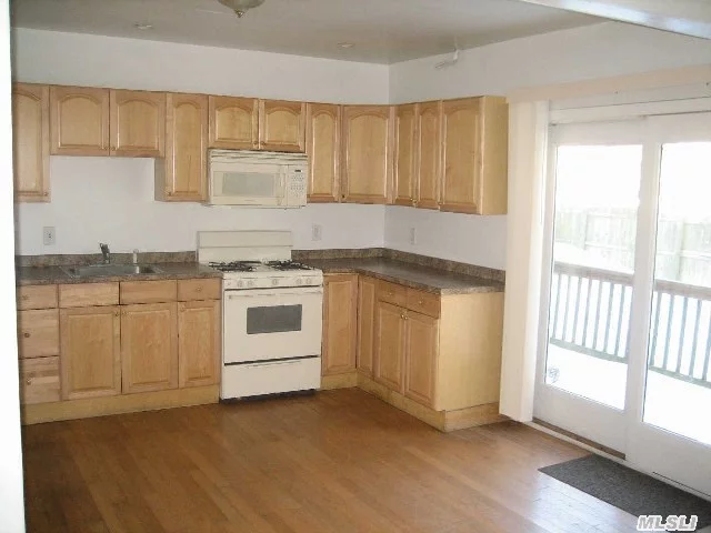 Large 3 Br With Wood Burning Fireplace, Hw Floors, Full Bath, Private Driveway, Washer/Dryer Hook Up In Basement.