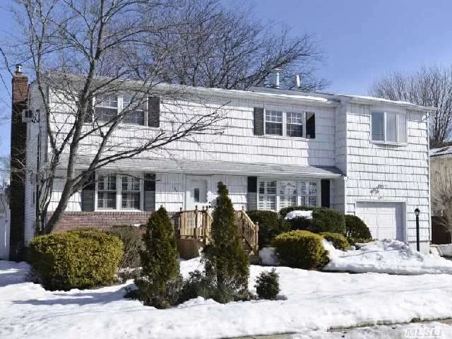 Fabulous For A Large Or Extended Family. Beautifully Maintained And Updated Colonial. Hard Wood Floors And Wood Doors Throughout.Bedrooms On 1st&2nd Floors. Updated Windows(2002), 2 New Full Baths, Extra-Wide Driveway, Roof (2000), Heating System(2008), Pvc White Fenced Property, 200 Amp. Large Principal Rooms. Endless Possibilities. Taxes Being Grieved.