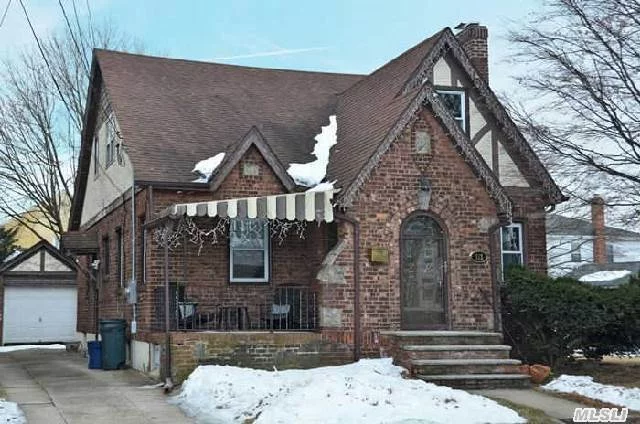 Classic Brick & Fieldstone Cape In New Hyde Park-Garden City Park Schools. Living Room Features Wood Burning Fireplace, Top Of The Line Gourmet Eat In Kitchen. Hardwood Floors, High Hats Galore. Finished Basement W/Full Bath, Office & Den Area, Ose. Central Alarm All On Oversized Plot! Best House In Garden City Park! Oil Heat/Gas Cooking! Taxes Do Not Reflect Star $1049.62