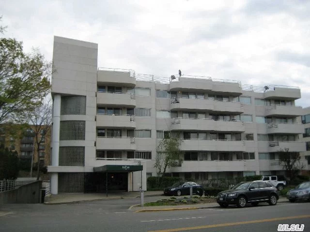 Renovated 2Br X 2.5Bath Condo In The Pavillion. Corner Unit With Southern Exposure. Updated Kitchen With Granite And Stainless Appliances. Lr/Dr Overlooking Courtyard,  Mbr W/Marble Mbath, W/D In Unit. Two Indoor Parking Spaces, 24Hr Doorman, Close To Lirr And Town. Credit Report And Income Verification Required.