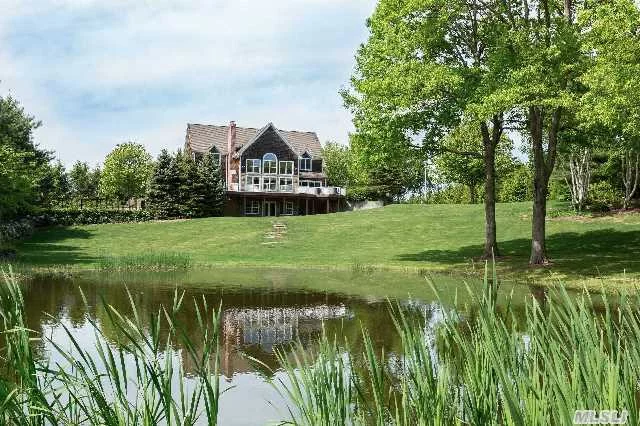 Beautiful Traditional Situated On 6 Acres Offers The Ideal Place For Entertaining Or Family Living.   Enjoy Ultimate Privacy And Incredible Views Of Professionally Landscaped Grounds And Pond. This  3400Sf Home Boasts A Large Deck, Free Form Pool Surrounded By Brick Patio & Has Room For Tennis And Horses! A True Gem!