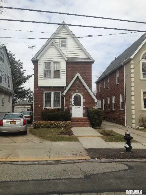 Brick Tudor Colonial - Good For Large Family - 5 Br&rsquo;s, 2+2/2 Baths. Near To Sd#29 Schools, Union Tpke Shops, Buses - Walk To Subway; Near To St. John&rsquo;s University. Newly Pointed Brick, Slate Roof, New Gas Boiler, Basement Sump Pump.