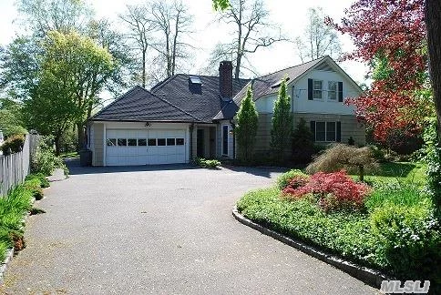 Expanded Waterfront Colonial Features Large Formal Living With Fireplace, Formal Dining, Eik Open To Large Family Room. Light And Bright Large Master Suite With Bath, 3 Additions Beds With Full Bath, 2 Car Attached Garage, 100 Feet Of Bulkhead With Cut In Boat Slip Next To Boathouse. Large Private Yard.