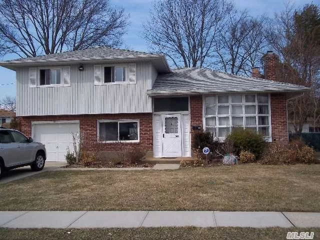 Expanded Split Home In Jericho Sd, Move In Codition, Perfect Location, Beautiful Mahogany Color New Wood Floors, New Bath, Updated Kit, Private Backyard