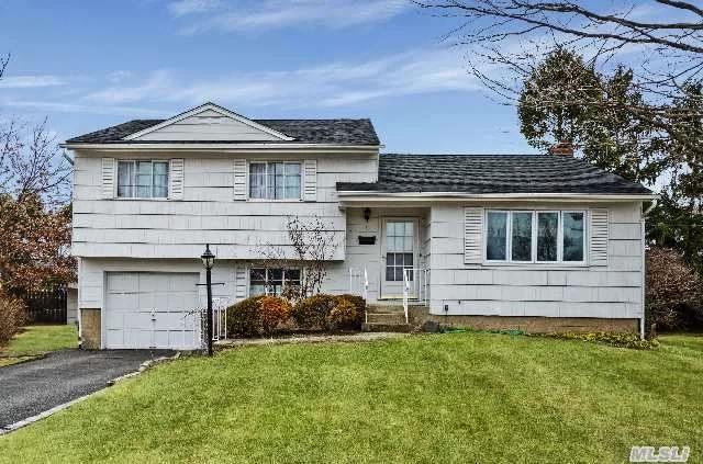 Beautiful, Sunny, Split Level. Freshly Painted Interior, Updated Windows, Wood Floors, New Carpet. Lovely Cul De Sac Location.  Shed In Backyard Included. A Must See.